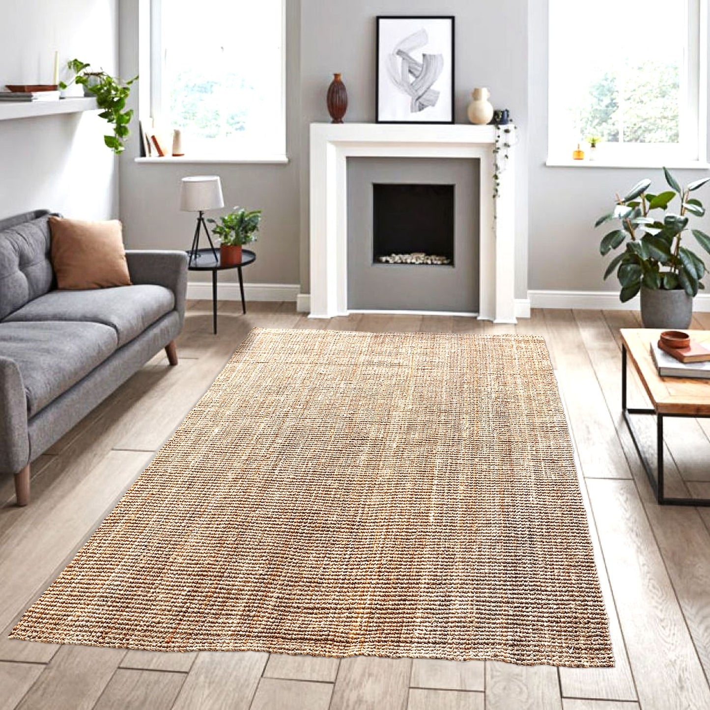 A natural jute rug with a boucle weave pattern, placed on a wooden floor in a living room setting, complements the surrounding decor.