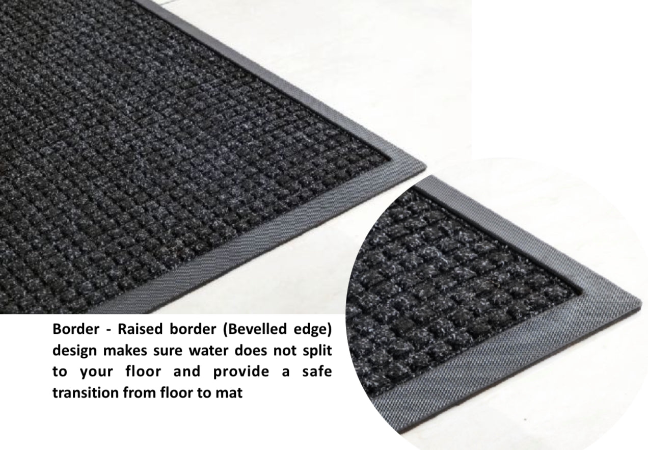 Two black entrance mats with raised borders on a white background.