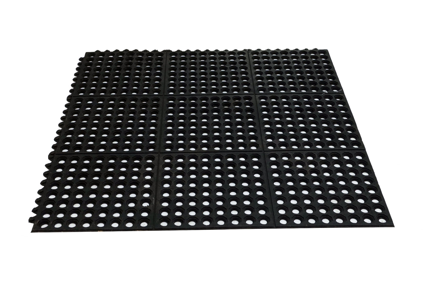 Black perforated mat on a white background