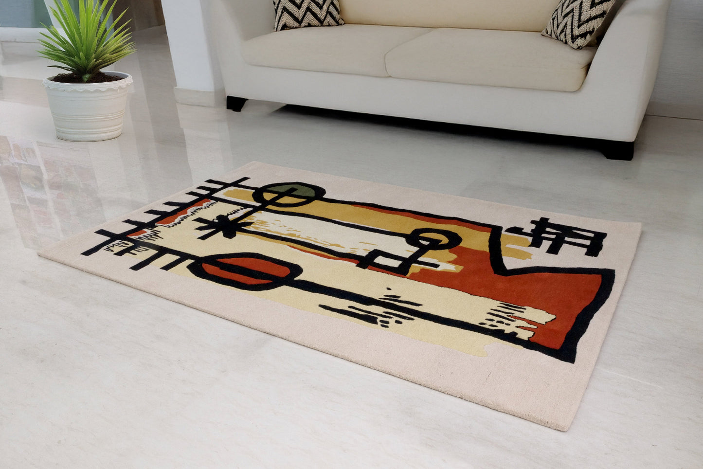 Colorful abstract rug on a light gray floor with a white couch and plant in the background