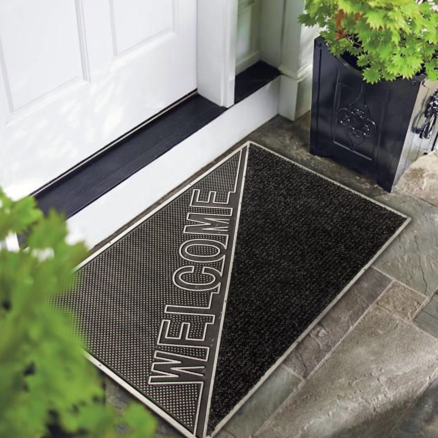A black rectangular doormat with the word 'WELCOME' in bold letters, placed on the doorstep of a home.