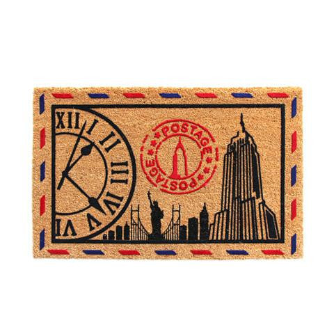 A rectangular, anti-slip, flock floor mat with a cityscape print, predominantly black with red and blue accents, and a white clock design in the centre.