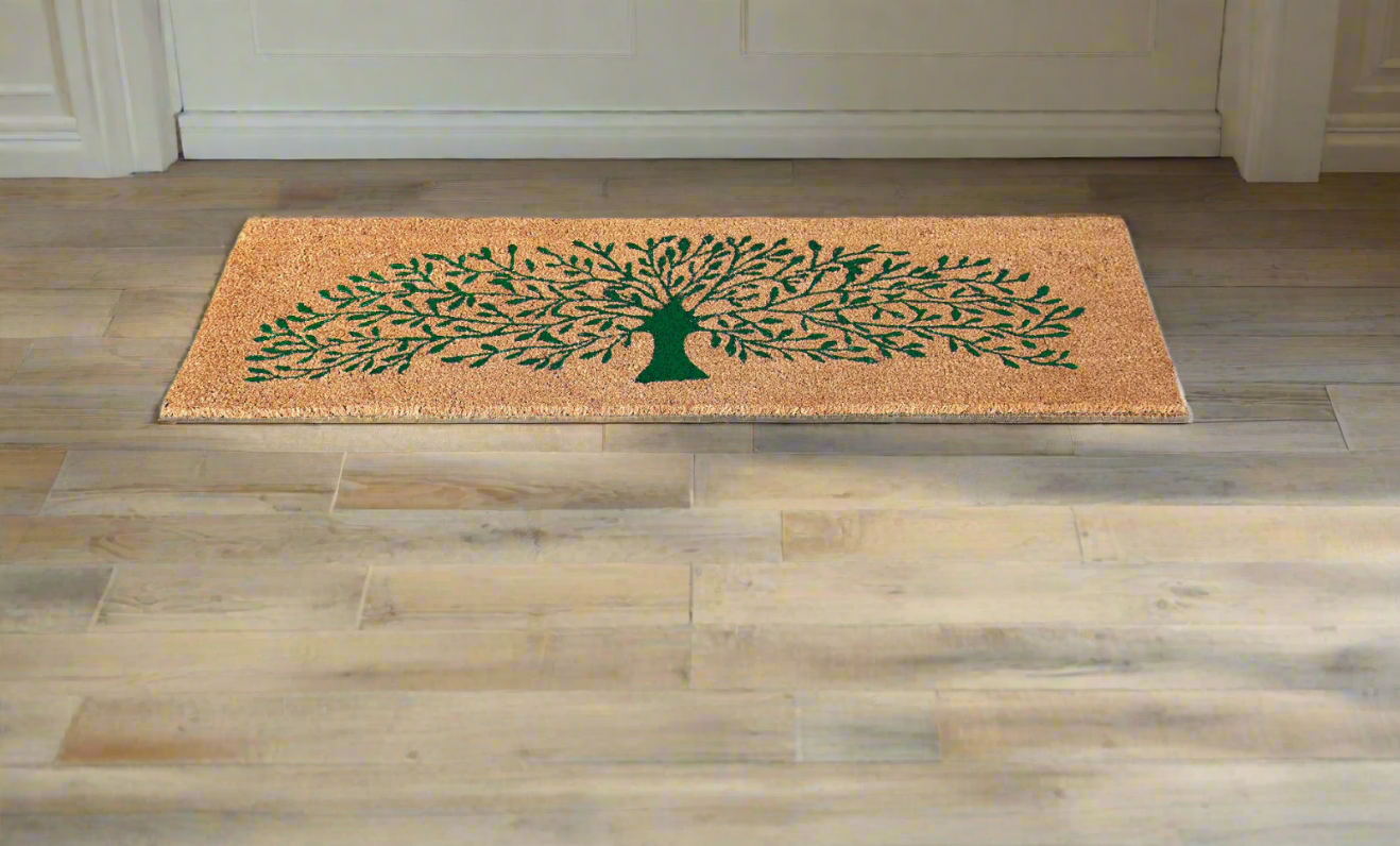 A rectangular doormat with a green tree design on a natural beige background.