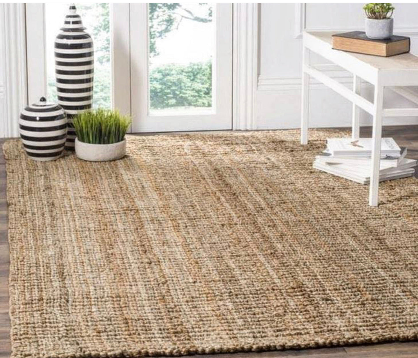 Woven jute rug in a room with decor elements.
