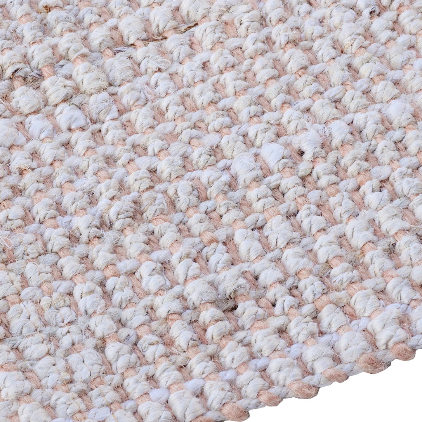 Close-up of a textured beige and white rug