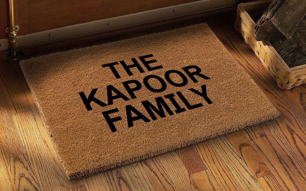Rectangular coir floor mat with black   Welcome printed design on a coir surface, with an anti-slip backing