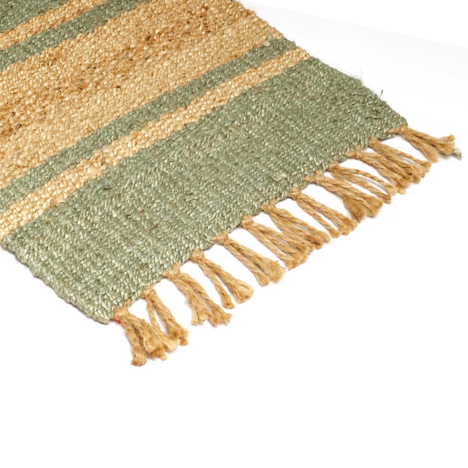 Striped jute rug with fringes on a white background