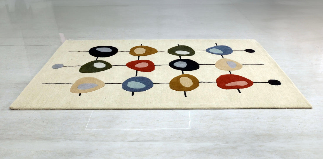 Decorative rug with circular patterns in various colors on a light gray floor.