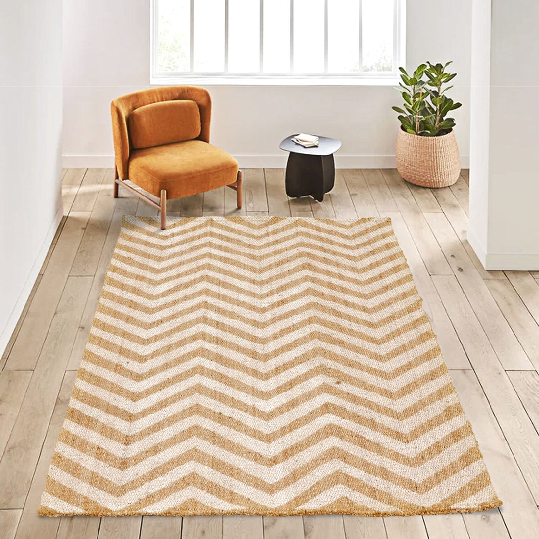 A zigzag-patterned jute rug in a living room setting with a chair and a plant.