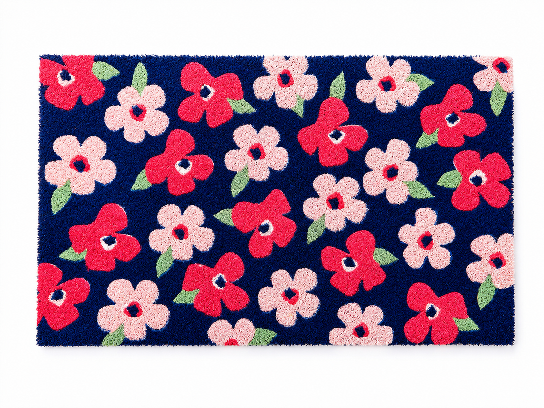 Floral patterned doormat with red, pink, and white flowers on a blue background