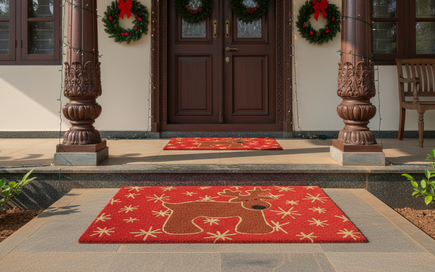 Red doormat with reindeer design in front of a house entrance