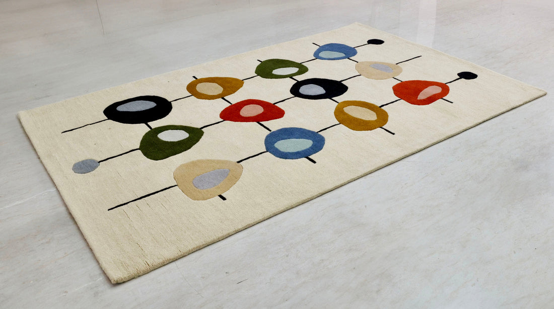 
                      
                        Decorative rug with colorful abstract design on a plain background
                      
                    