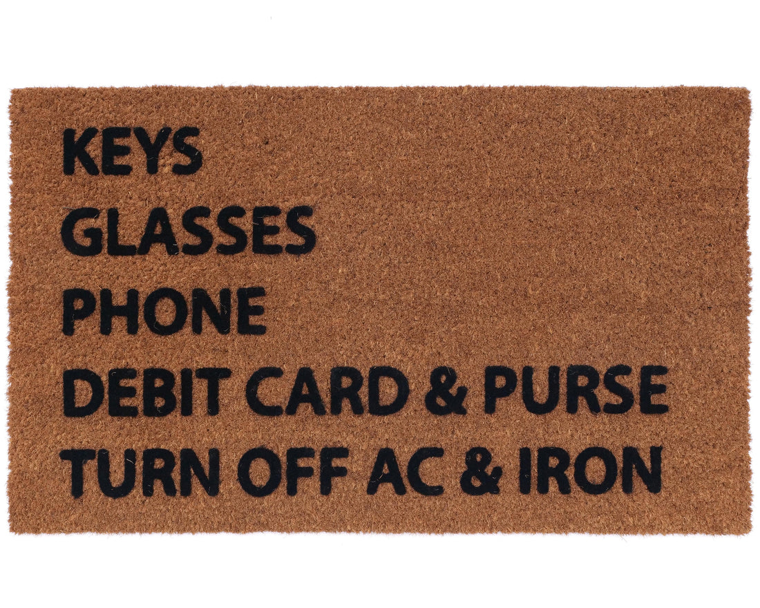 
                      
                        functional doormat features a printed checklist of commonly forgotten items – keys, glasses, phone, debit card & purse, and a reminder to turn off AC & iron
                      
                    