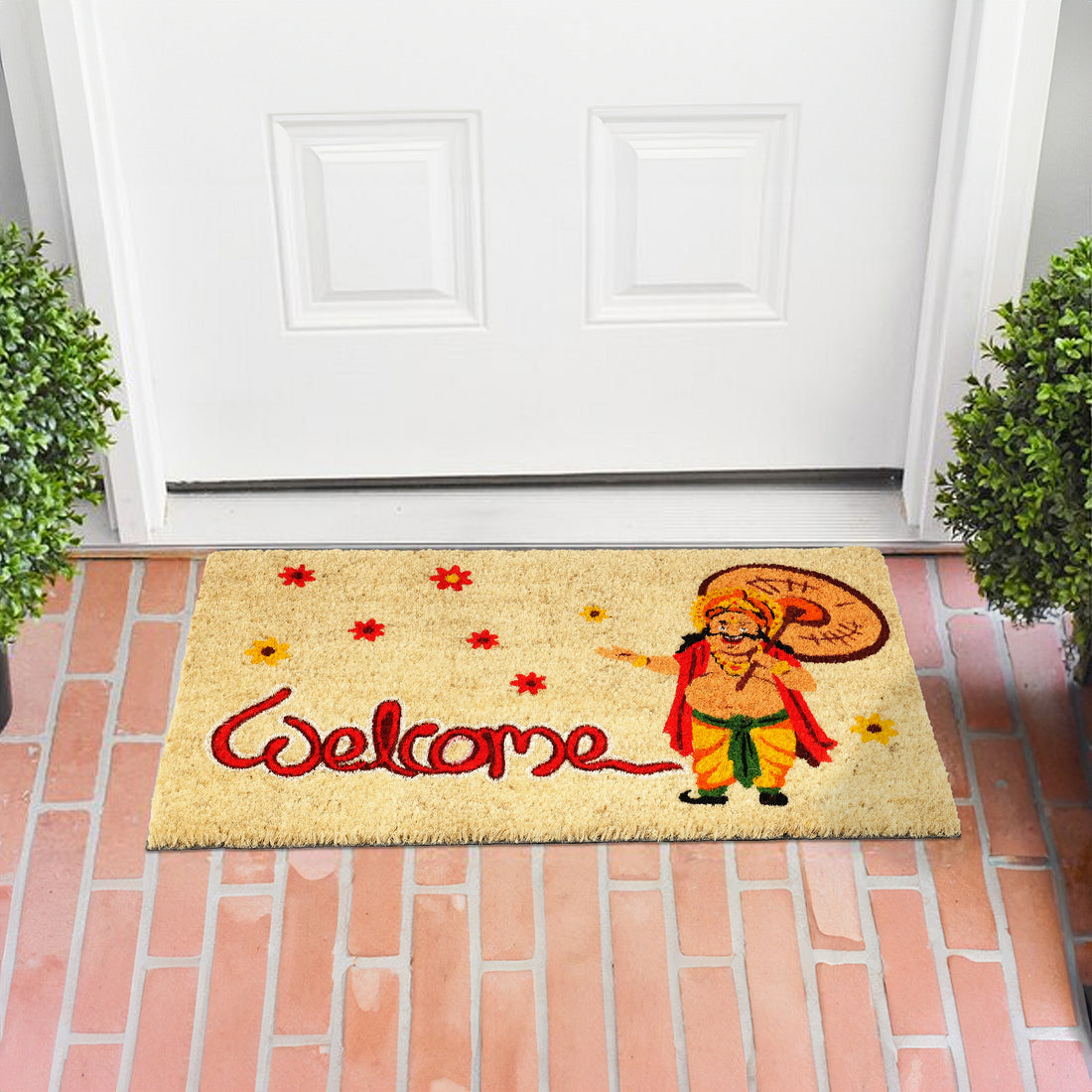 A rectangular beige doormat with the text 'Welcome' with mahabali and flowers printed on it, representing the Onam festival in Kerala.