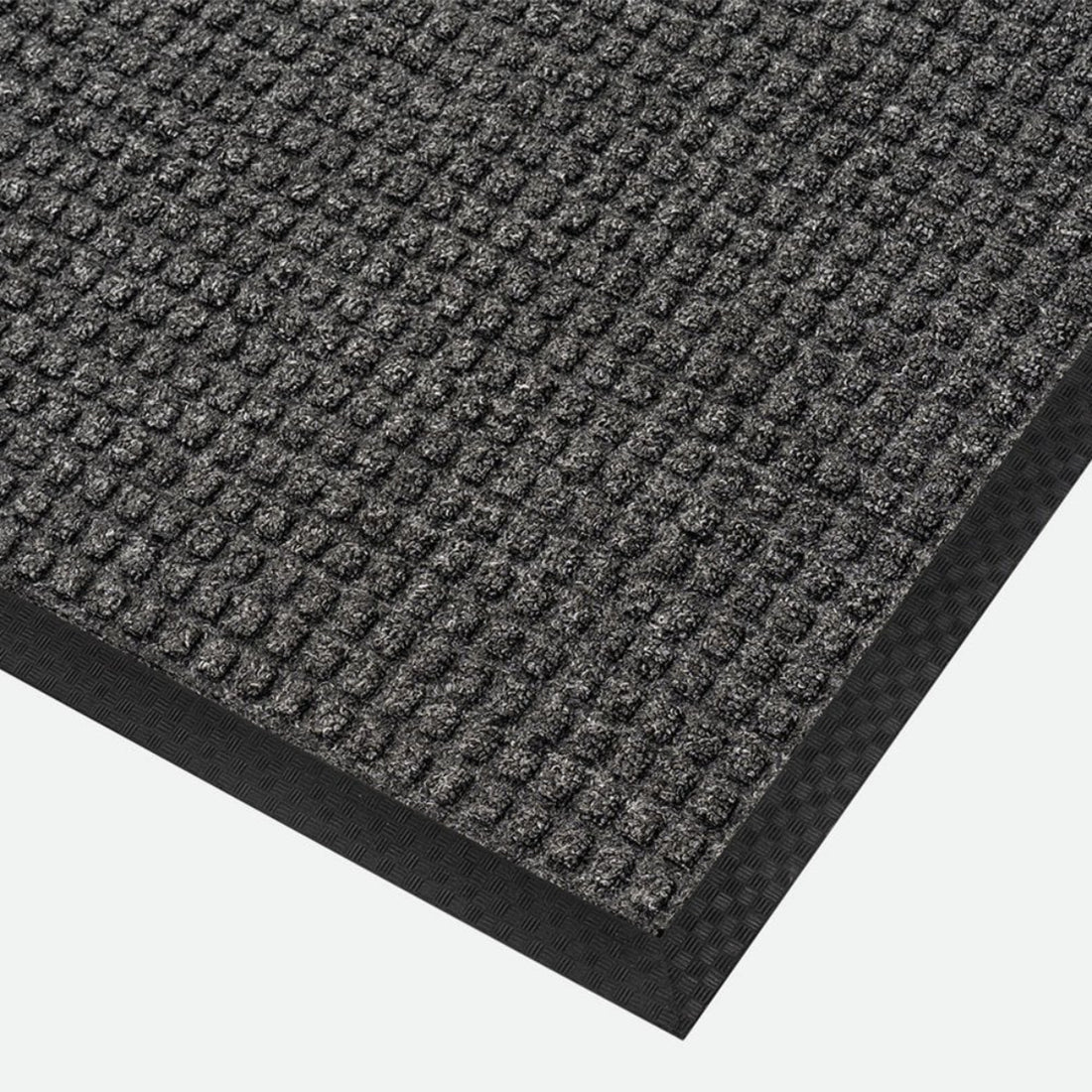 
                      
                        Close-up of a textured gray mat on a plain background
                      
                    