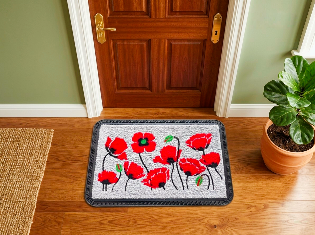 
                      
                        Decorative doormat with red poppies on a wooden floor in front of a door.
                      
                    