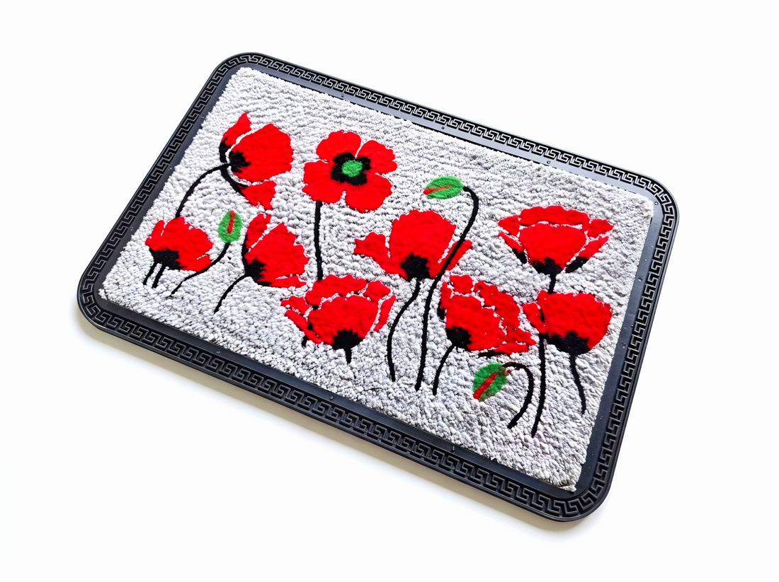 Decorative mat with red floral design on a white background