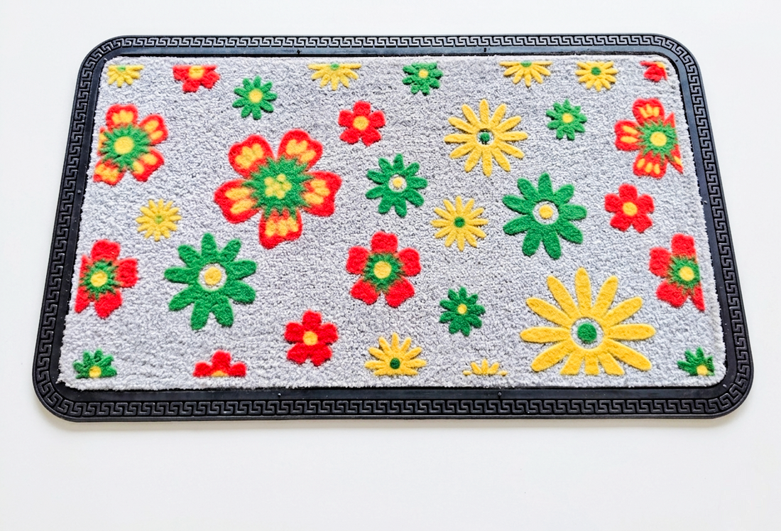 Rectangular mat with colorful flower patterns on a gray background