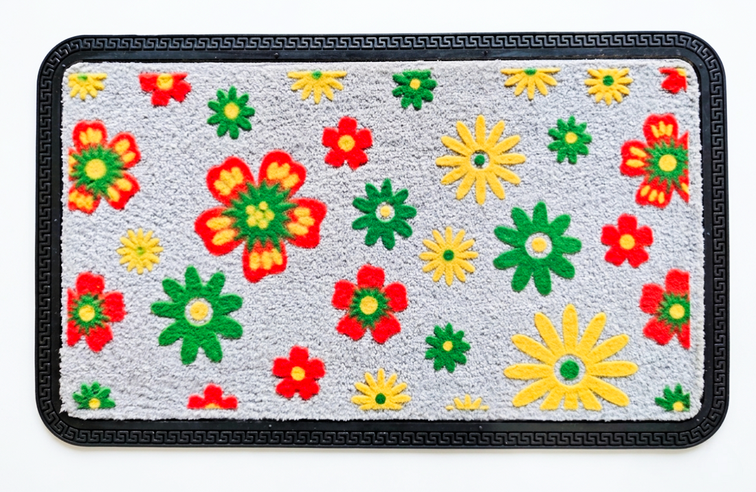 
                      
                        Floral patterned rug with colorful flowers on a gray background
                      
                    