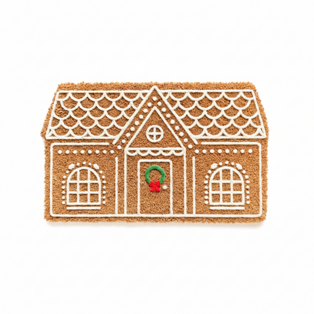 Doormat shaped like a gingerbread house with a red door and green wreath on a white background