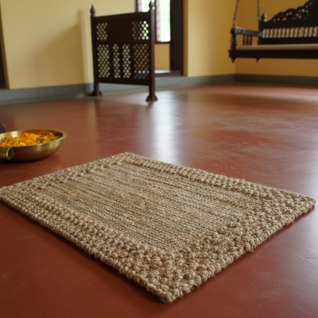 Textured jute mat on a wooden floor with a blurred background
