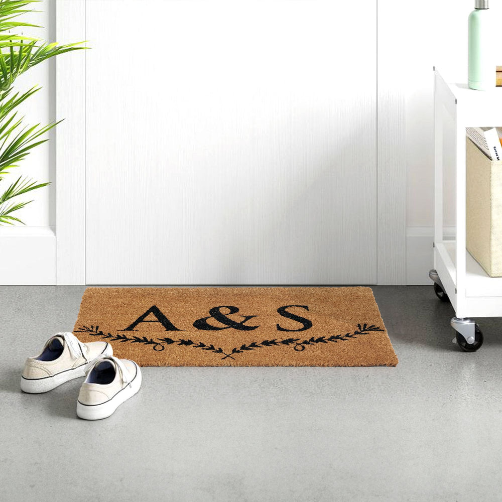 Personalized initials coir doormat with elegant leaf accent design
