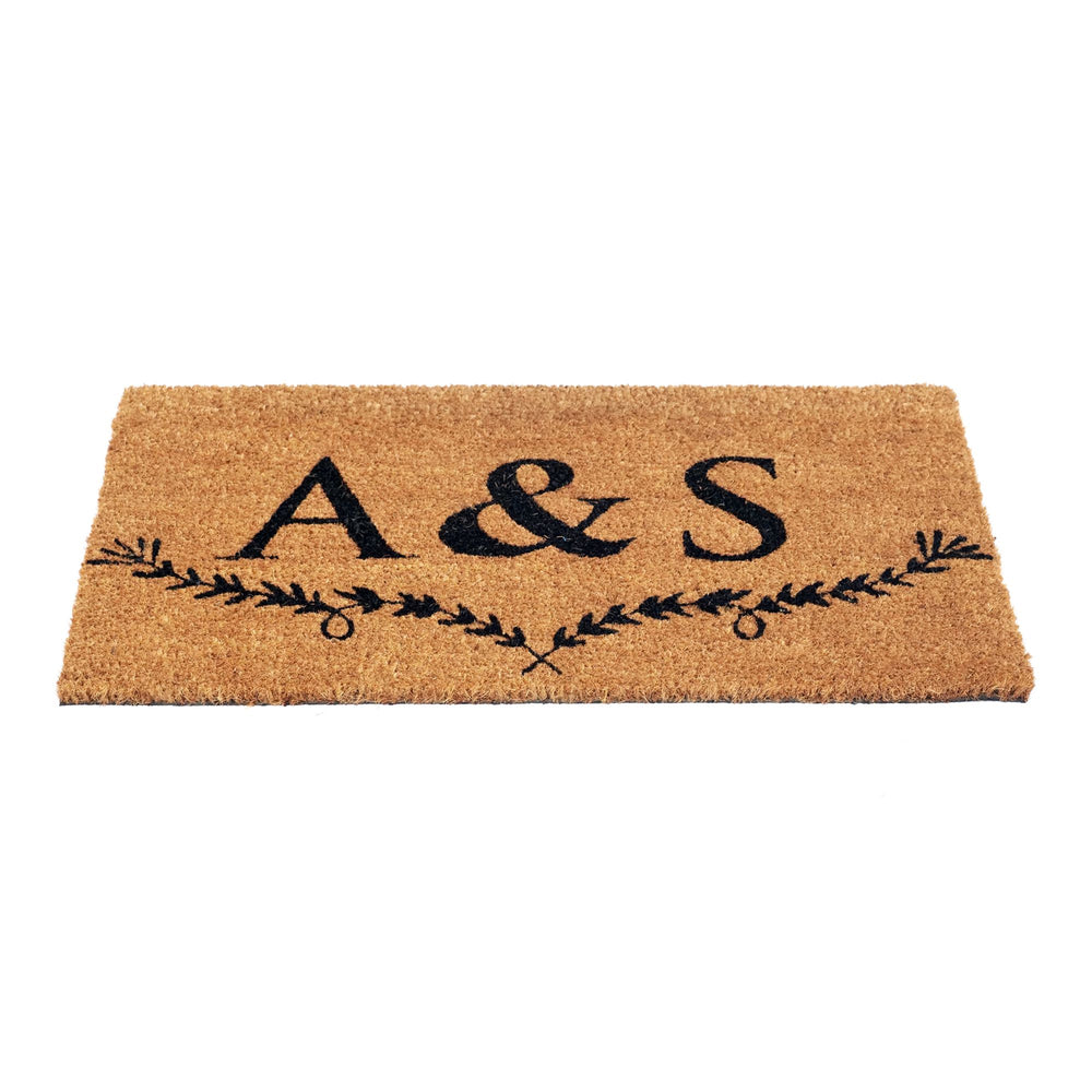 
                      
                        Initials doormat with natural coir fibers and leaf design accent
                      
                    