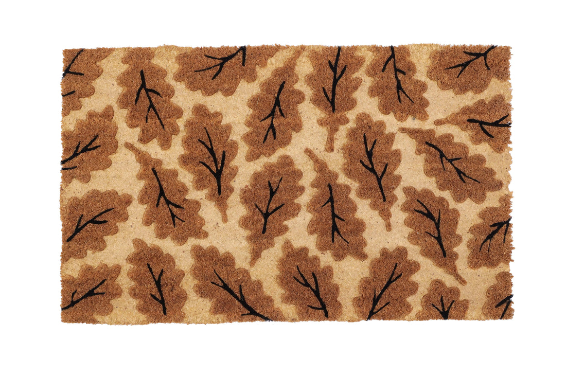 
                      
                        A rectangular beige doormat with an impression design of coir leaves.
                      
                    