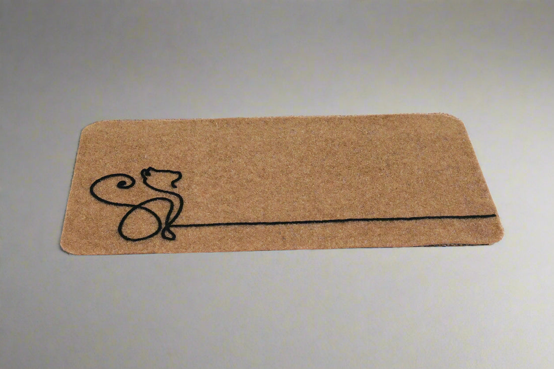 
                      
                        A beige rectangular doormat with a simple black line cat design at one end.
                      
                    