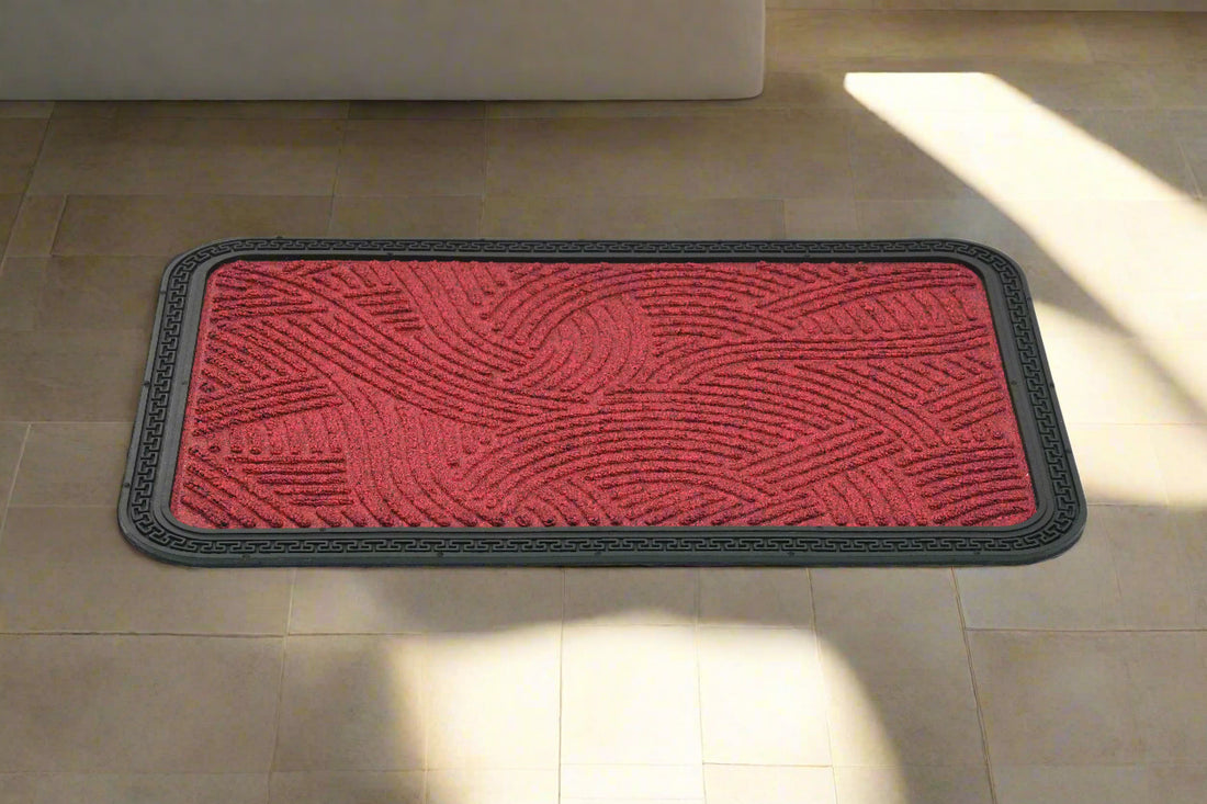 
                      
                        A red and black Mat quick dry anti-slip bath mat placed on a tiled floor, showing an abstract geometric pattern.
                      
                    
