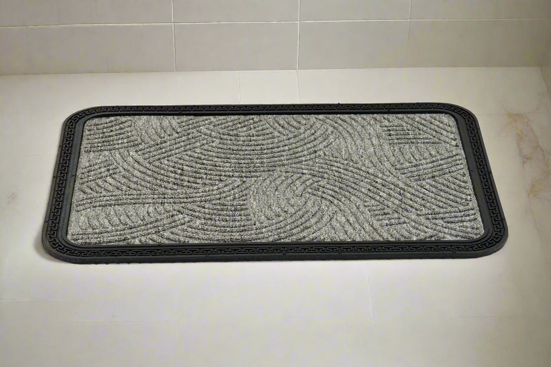 
                      
                        A grey rectangular Mat Quick Dry Anti Slip mat placed on a tiled floor, with a textured design and black edging.
                      
                    