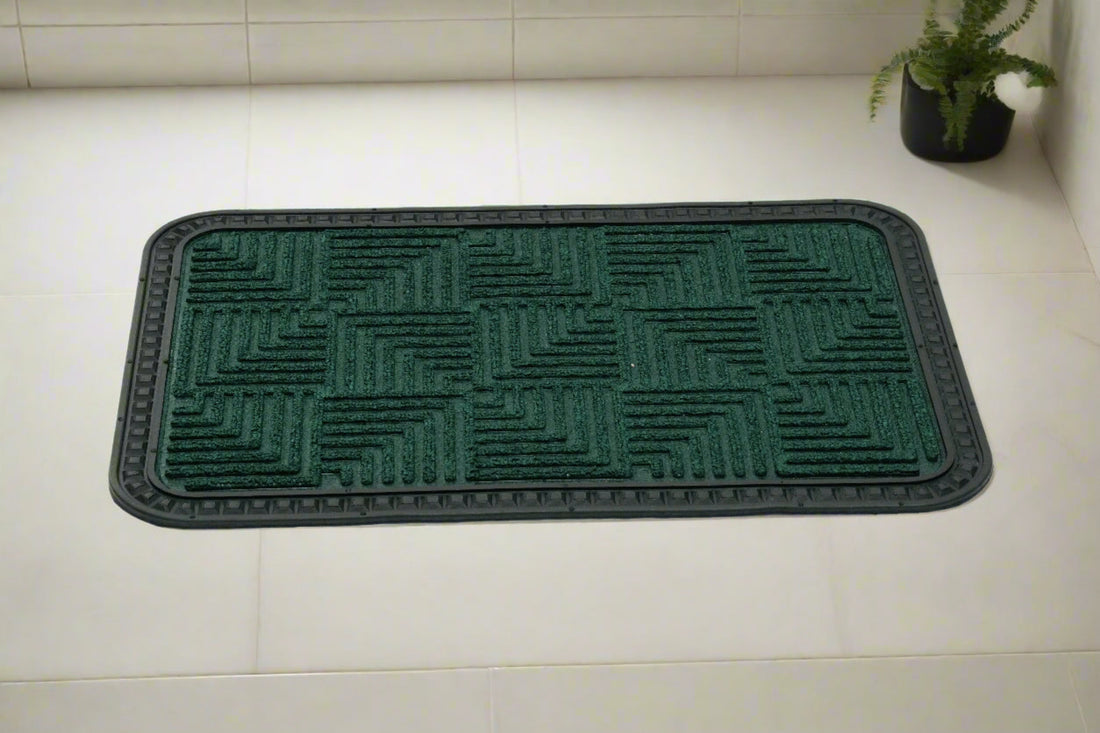 
                      
                        A green rectangular OnlyMat Quick Dry Anti Slip mat placed on a tiled floor, featuring a geometric step design.
                      
                    