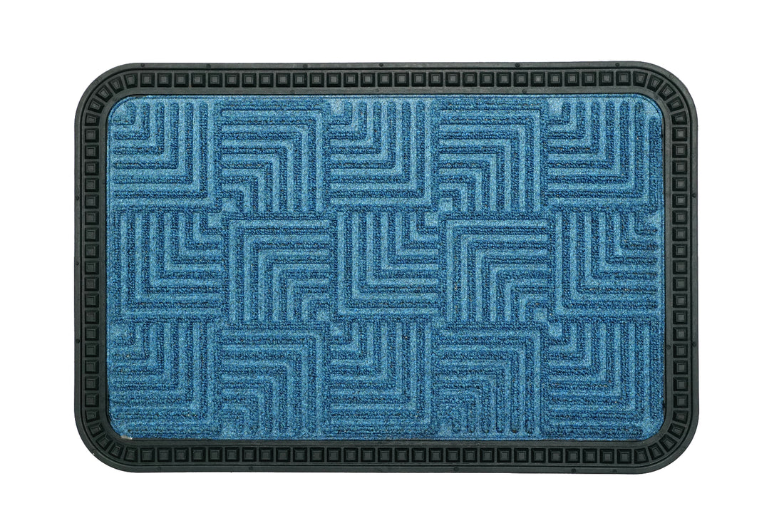 
                      
                        A blue rectangular bath mat with a geometric step design border and a textured center, laid on a white background.
                      
                    