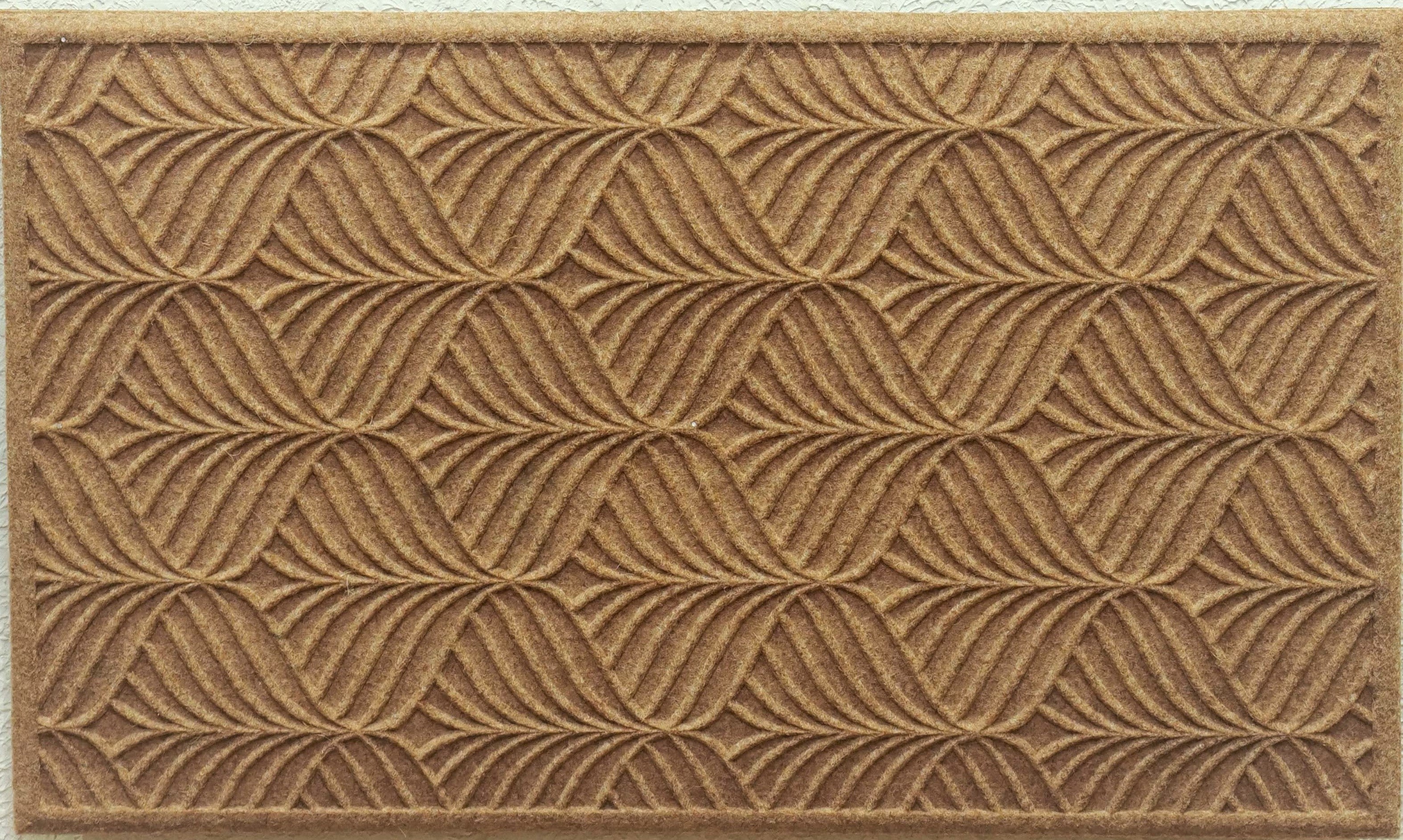 Brown doormat with a textured pattern