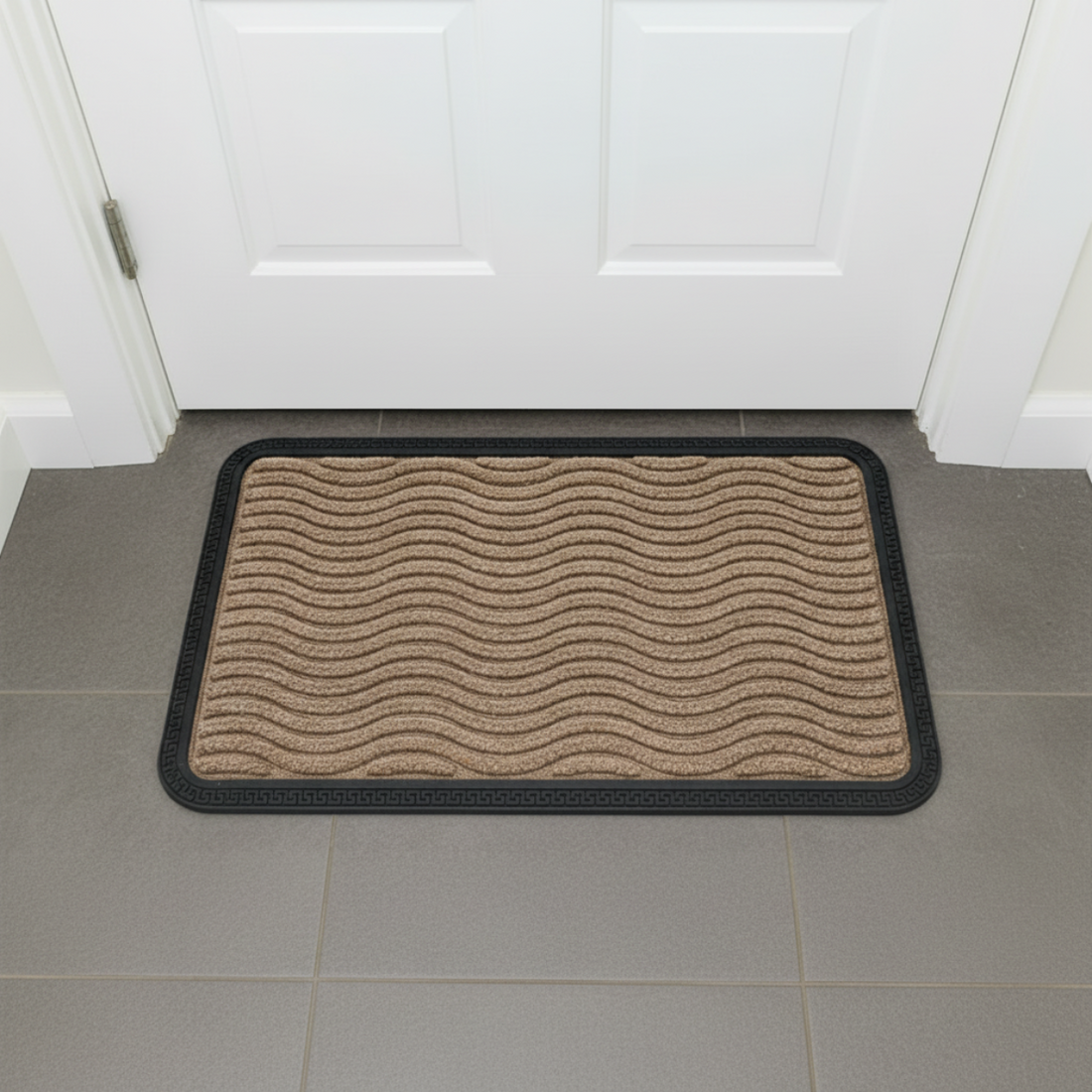 
                      
                        Wavy patterned doormat on a gray floor in front of a white door.
                      
                    