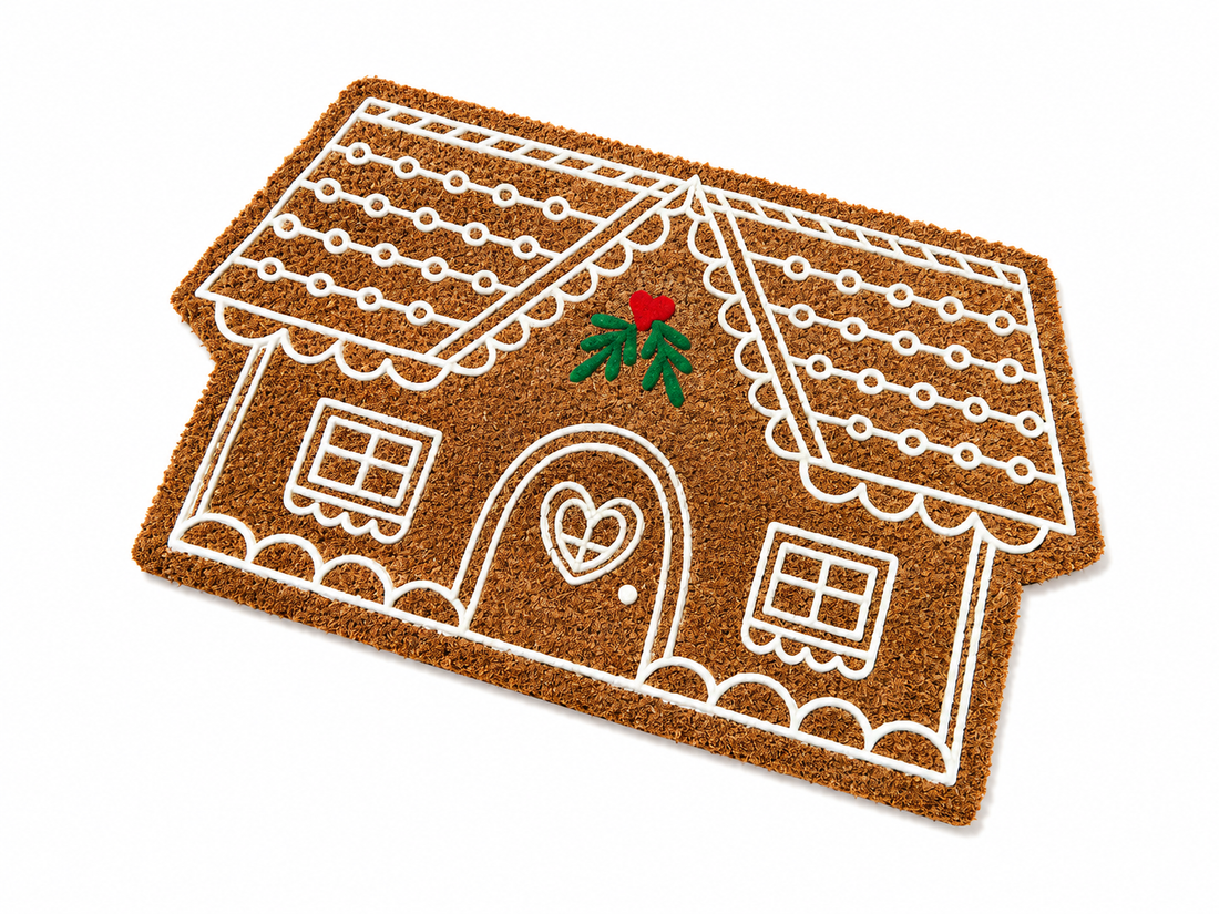 
                      
                        Doormat shaped like a gingerbread house with a heart door on a white background
                      
                    