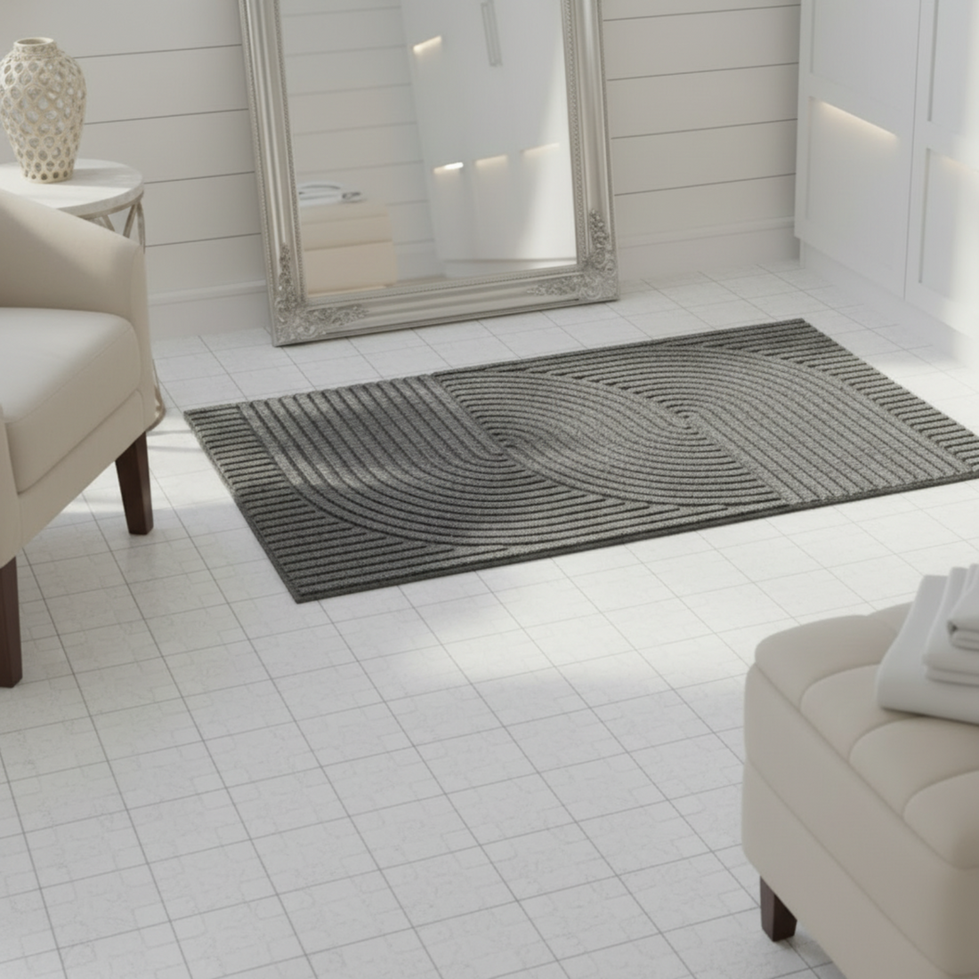 Gray textured rug on a light wooden floor with a mirror and chair in the background.