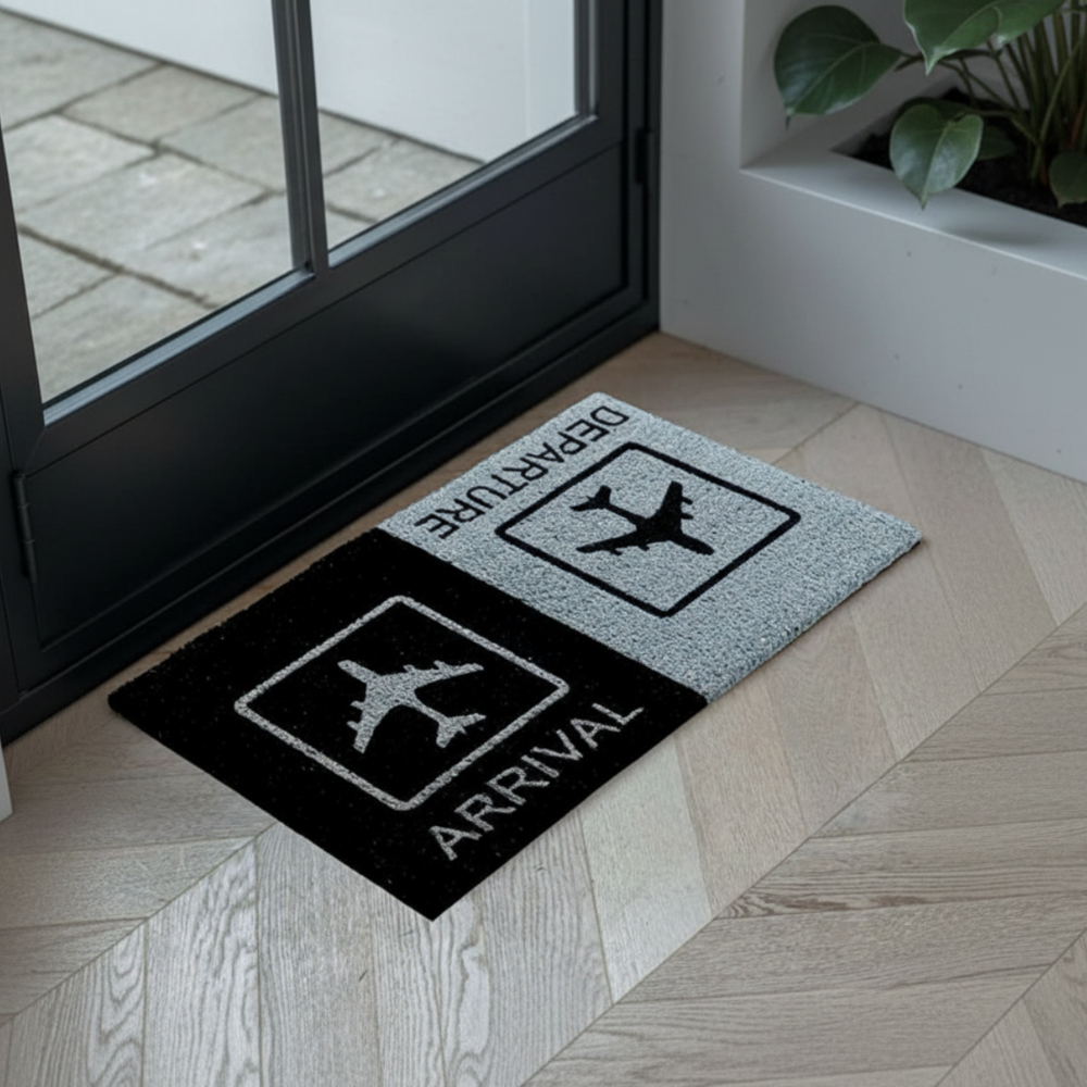 Doormat with 'Departure' and 'Arrival' signs on a wooden floor.