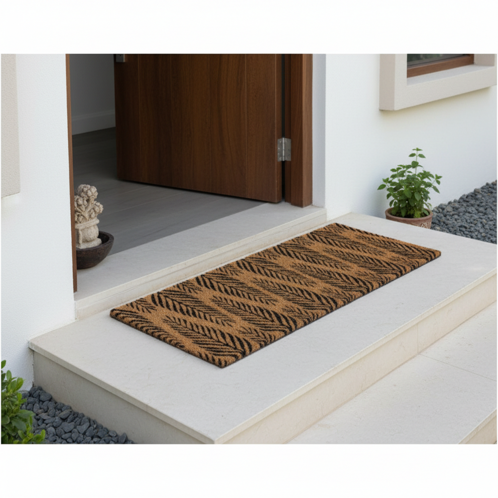
                      
                        Coir Doormat with leaf pattern on a white step outside a house
                      
                    