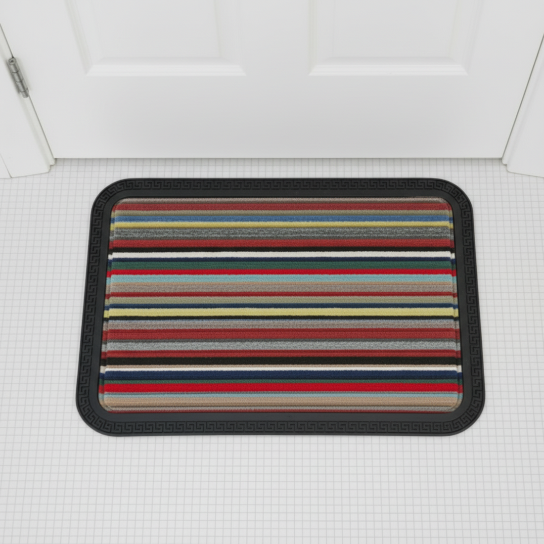 Striped doormat with multicolor pattern on a white floor