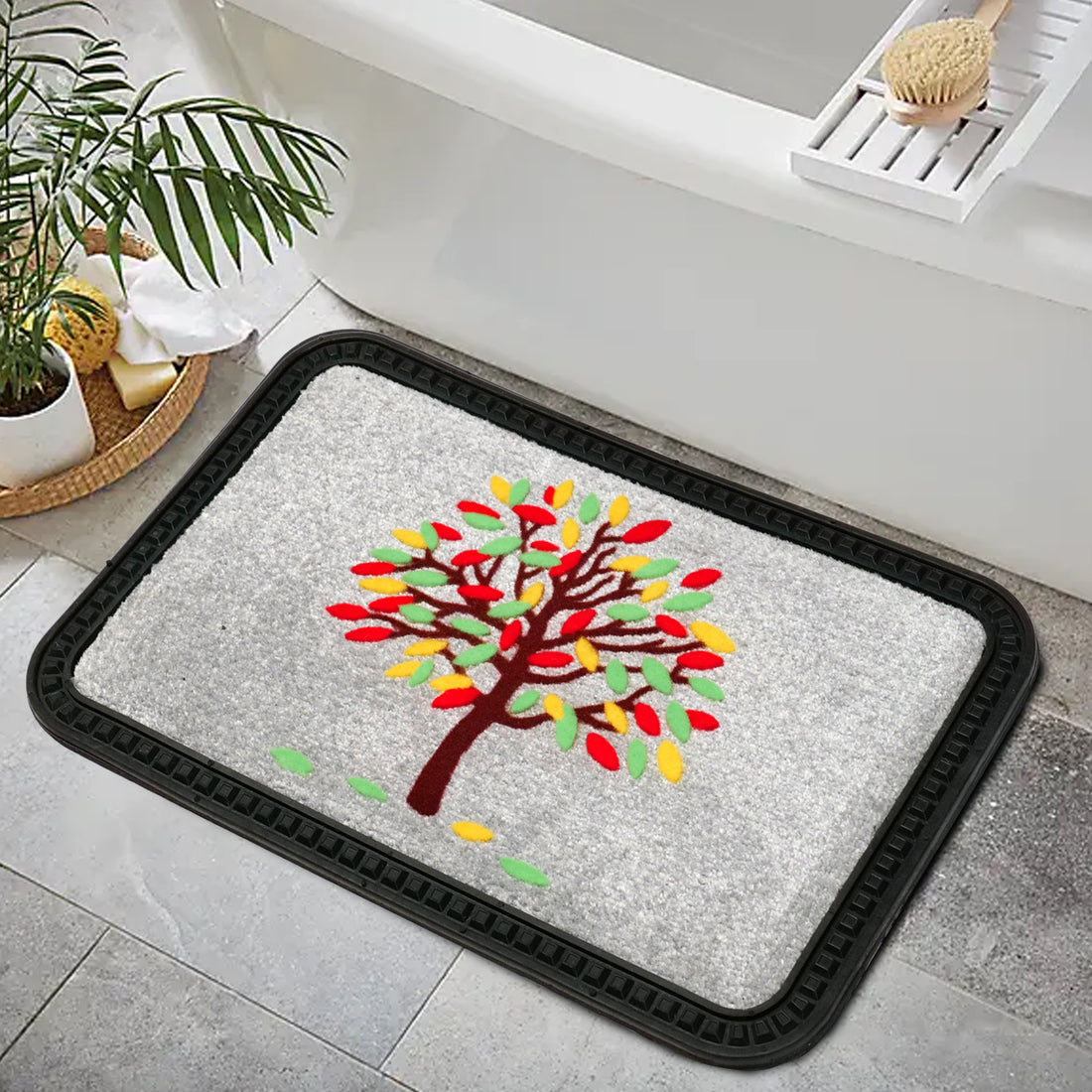 A rectangular doormat with a colorful tree design, placed on a bathroom floor near a bathtub and a wooden bench.