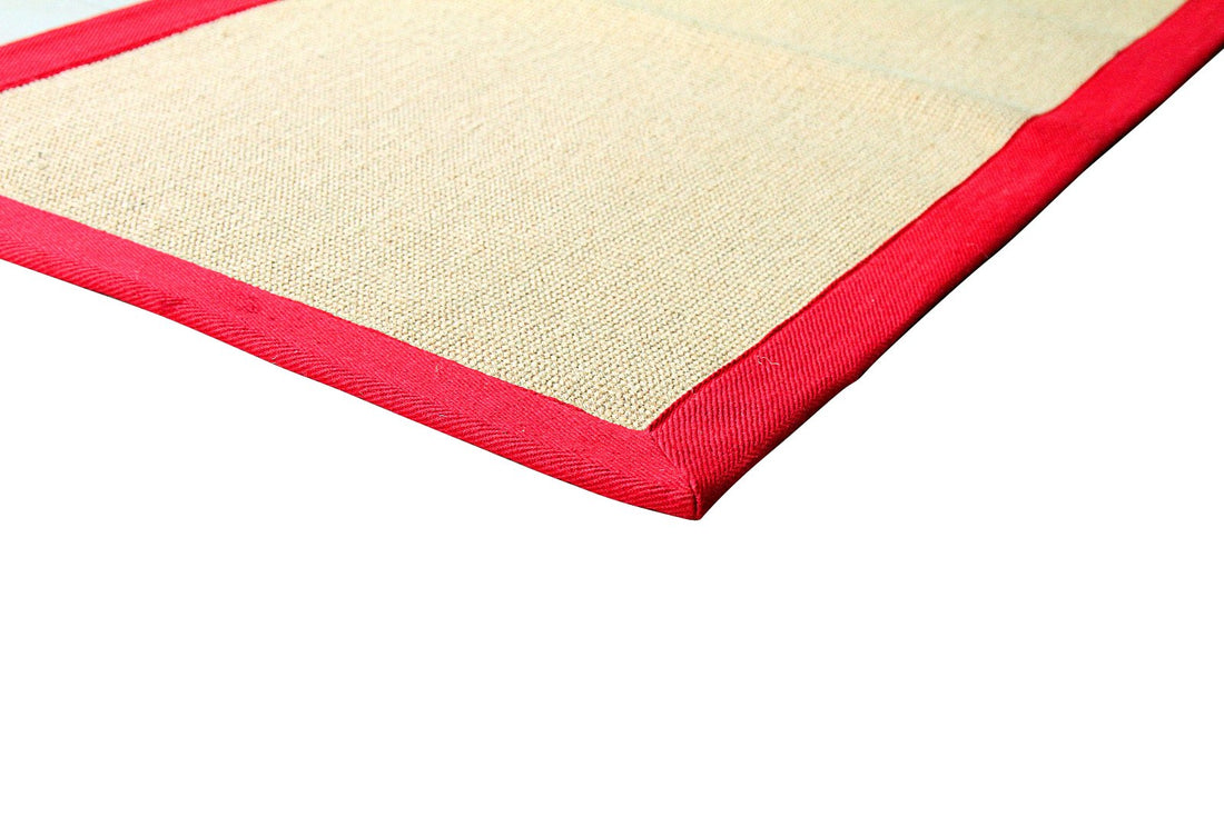 
                      
                        Beige jute mat with red border on a white background
                      
                    