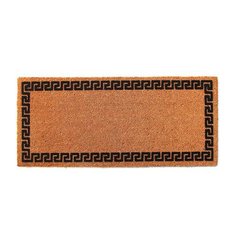 A long, rectangular, natural printed coir doormat with a geometric border design in black, placed on a plain background.