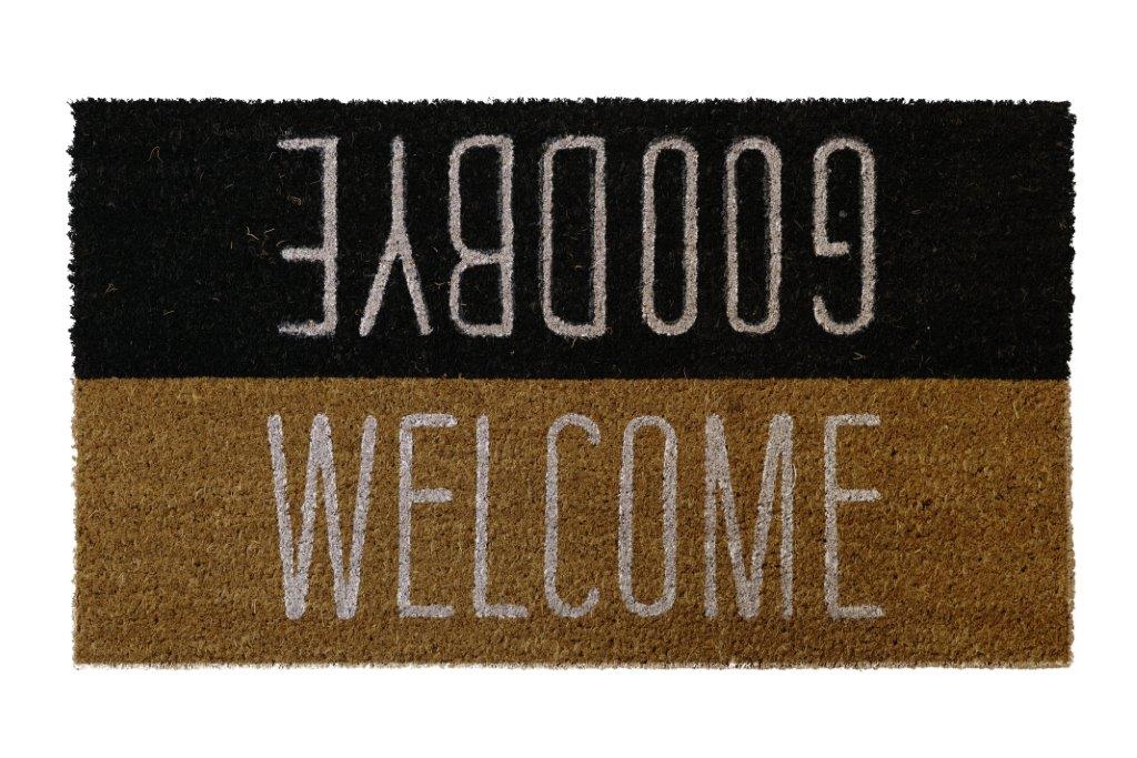 A black coir doormat with the text 'WELCOME' in white letters, with a  'GOODBYE' underneath in a lighter shade.