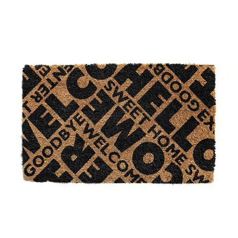 Rectangular coir doormat with black text pattern that reads 'Welcome' and 'Sweet Home', with a non-slip backing.