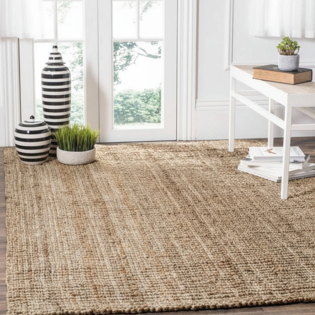 Woven jute rug in a room with decor elements.