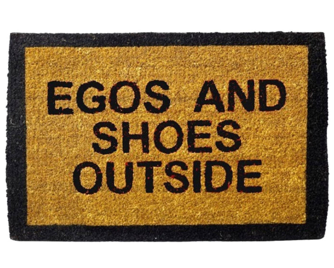 
                      
                        Doormat with text 'EGOS AND SHOES OUTSIDE' on a yellow background
                      
                    