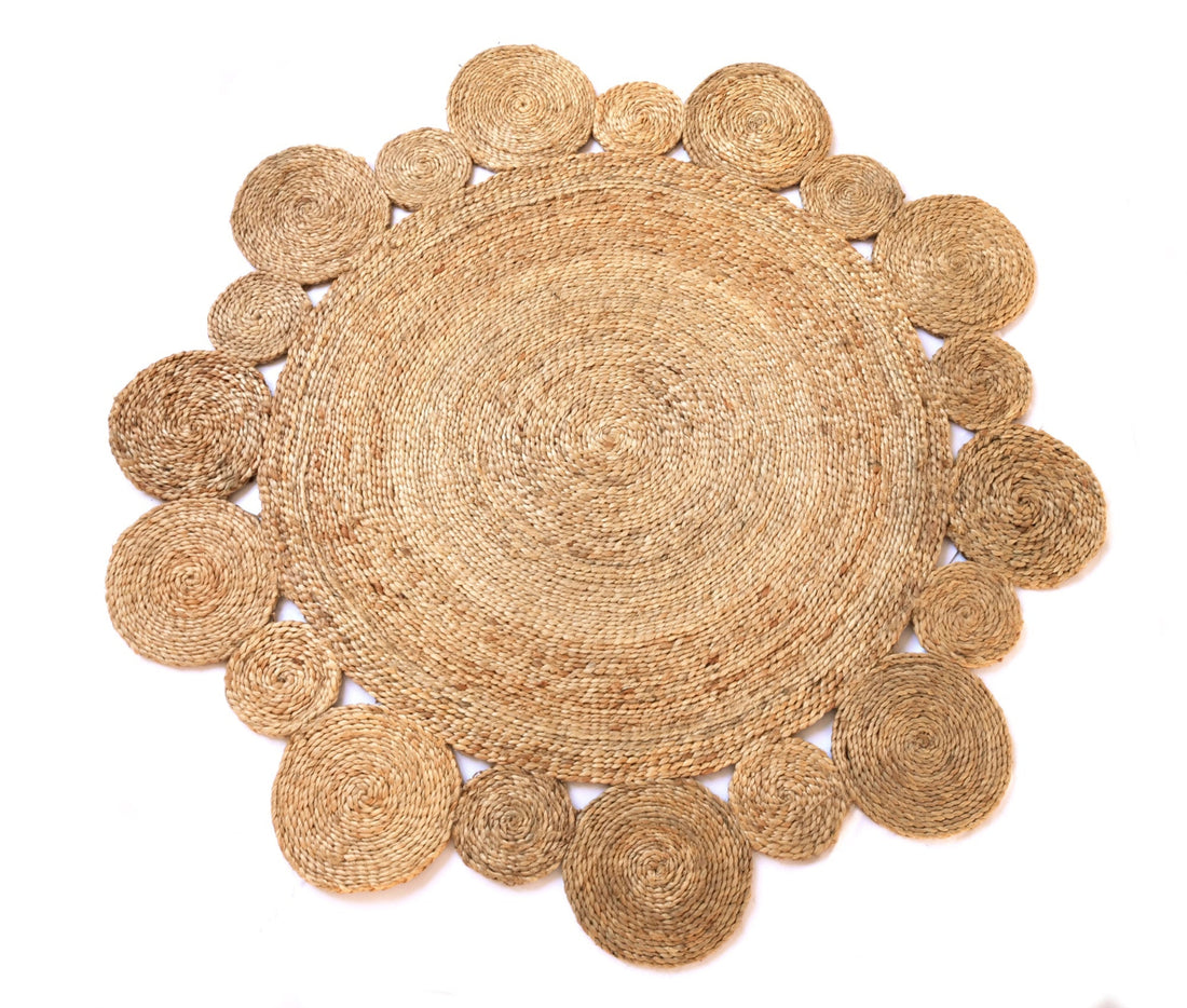 
                      
                        Round woven jute mat with circular patterns on a white background
                      
                    