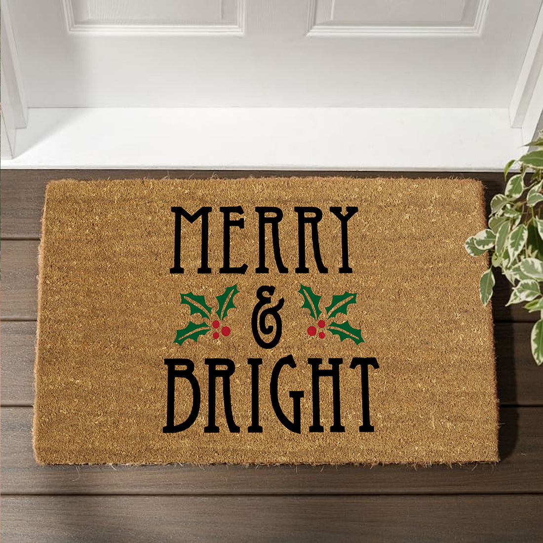 
                      
                        A natural coir door mat with 'Merry & Bright' text and Christmas-themed decorations, placed on a wooden doorstep.
                      
                    