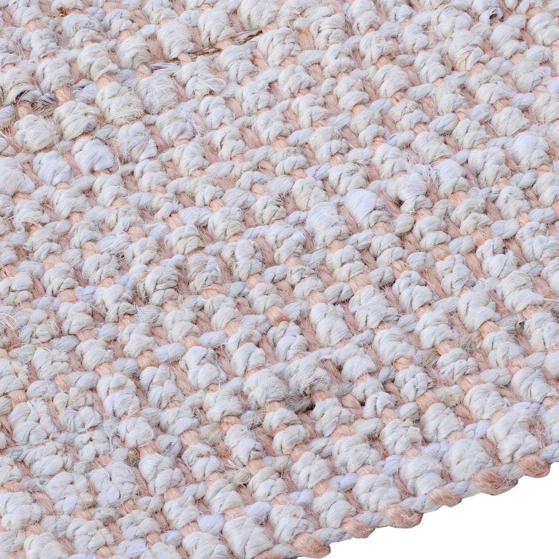 
                      
                        Close-up of a textured beige and white rug
                      
                    